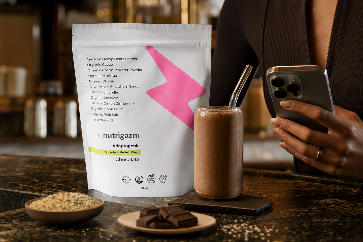 Chocolate Nutrigazm pouch beside a rich chocolate smoothie in warm cafe lighting